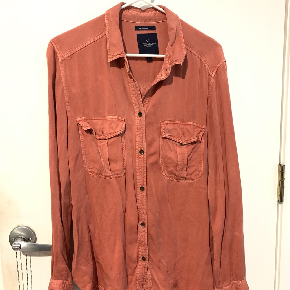 salmon colored long sleeve collared shirt